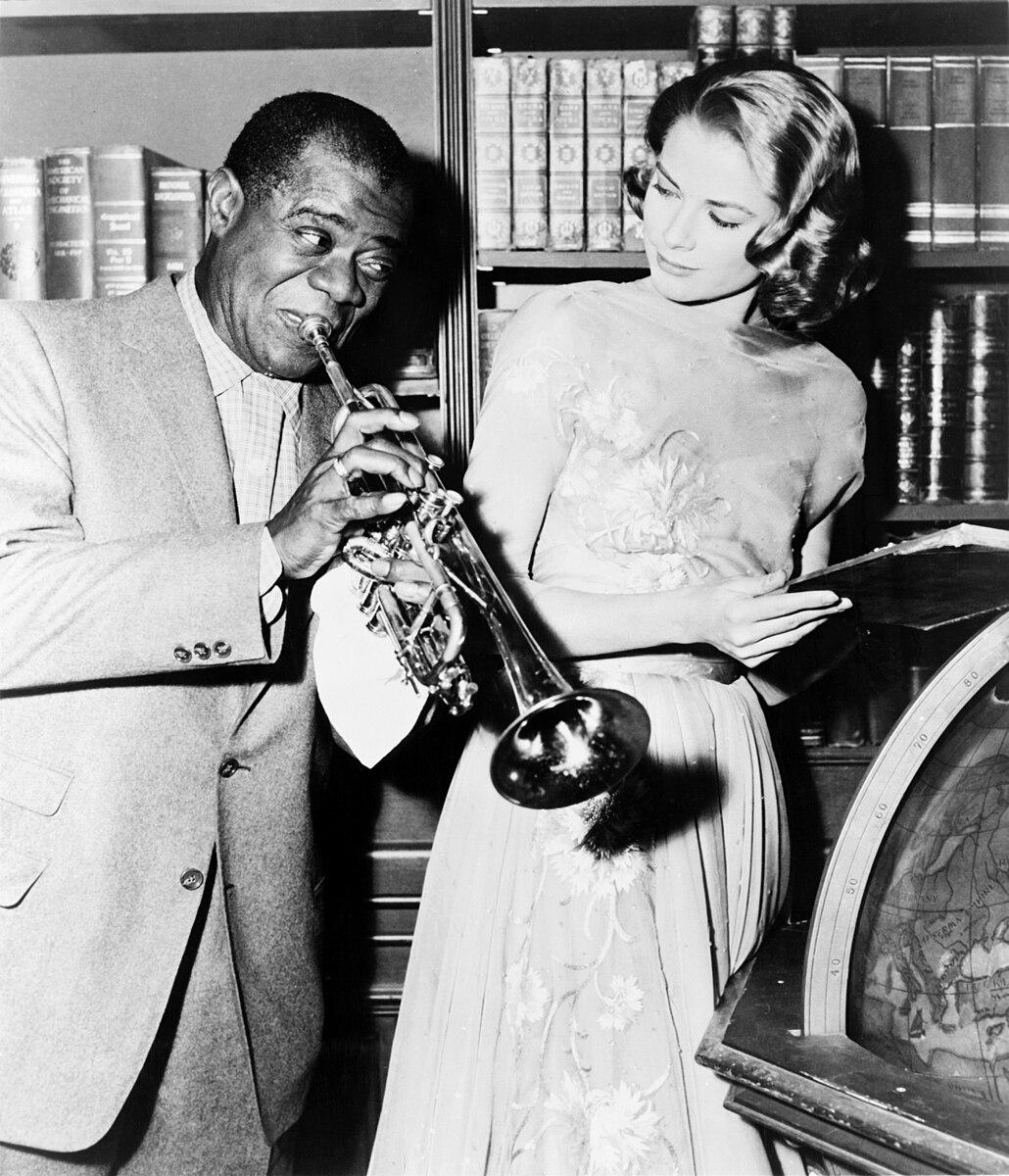 Louis Armstrong and Grace Kelly on the set of "High Society", 1956